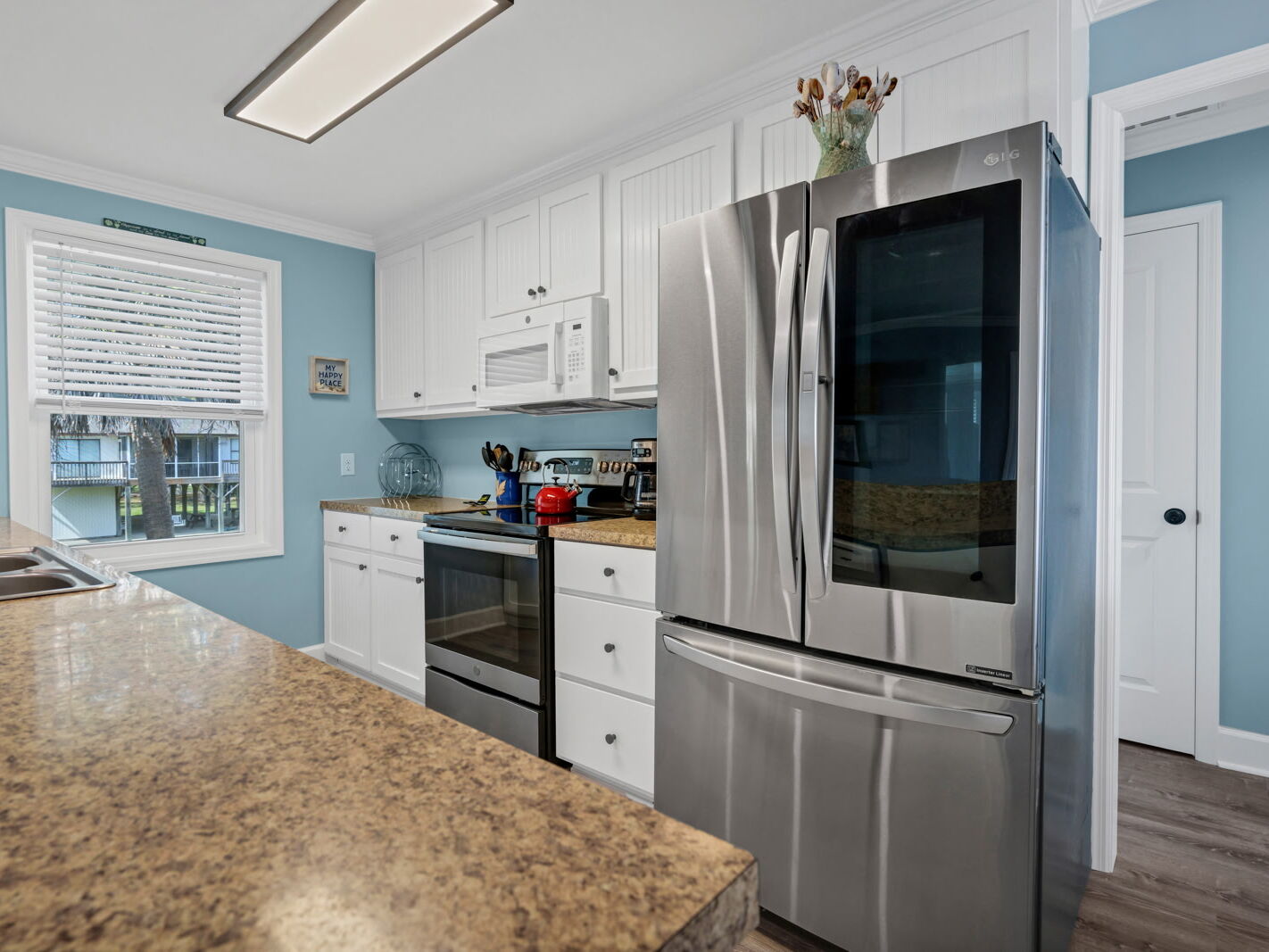 Complete interior refresh included new framing, flooring, windows, & paint