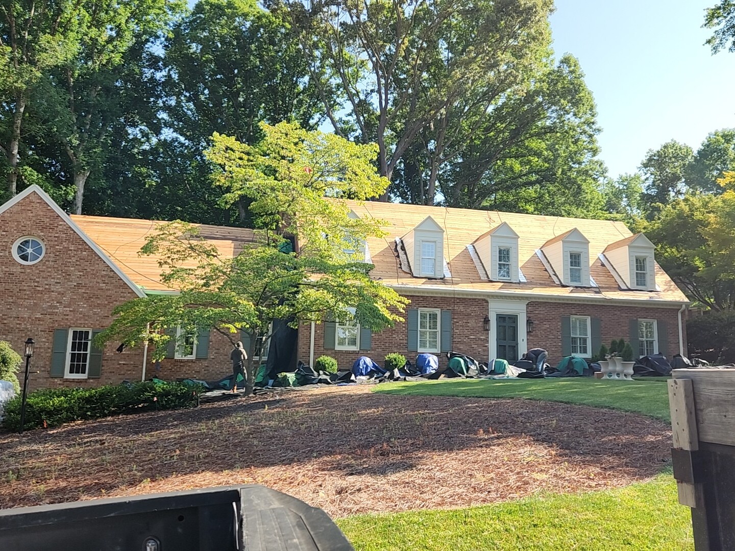 Prepping the roof for new shingles.